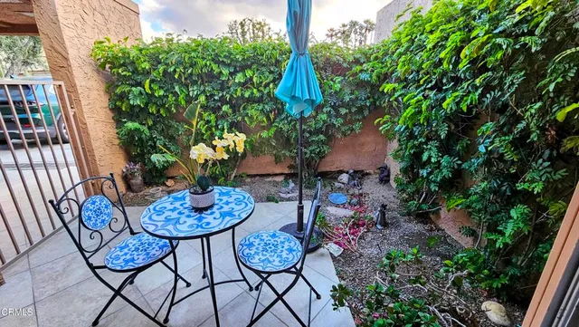 a outdoor space with lots of potted plants