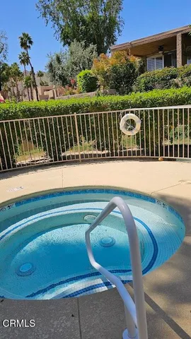 a view of swimming pool from a balcony