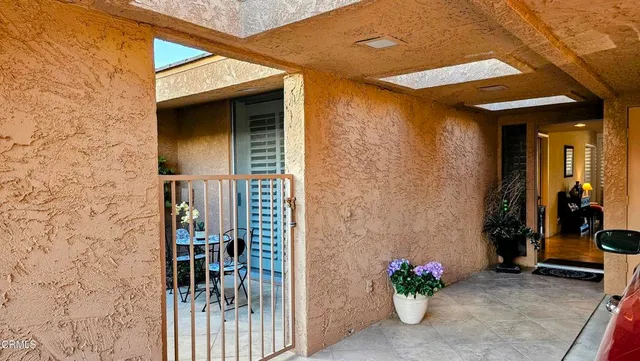 a view of a livingroom with furniture and windows