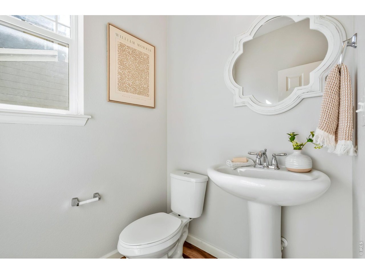 6759 Rainier Road Timnath, CO 80547 - Photo 11 of 30 a bathroom with a sink mirror and toilet