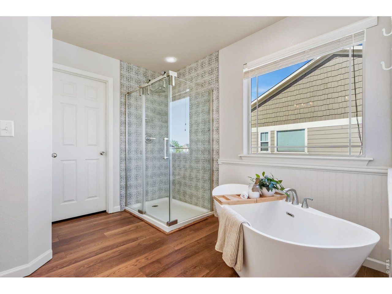 6759 Rainier Road Timnath, CO 80547 - Photo 15 of 30 a bathroom with a sink mirror and shower