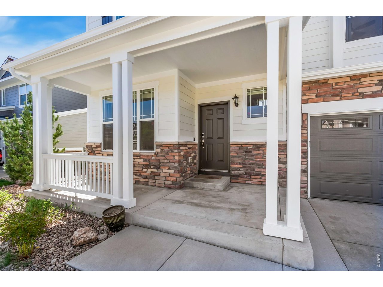 6759 Rainier Road Timnath, CO 80547 - Photo 24 of 30 a front view of a house with a yard