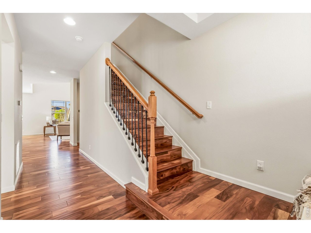 6759 Rainier Road Timnath, CO 80547 - Photo 25 of 30 a view of entryway and hall with wooden floor