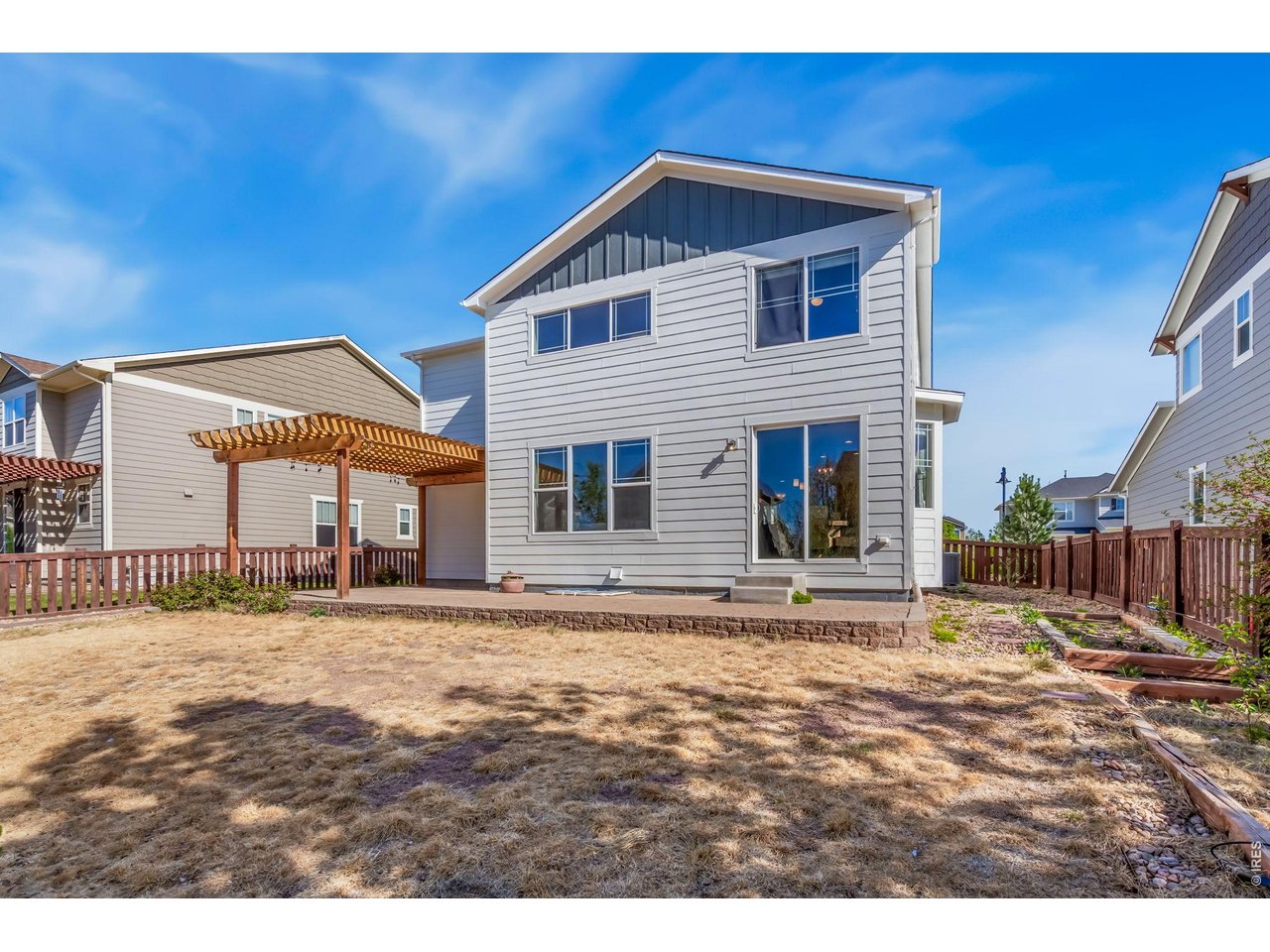 6759 Rainier Road Timnath, CO 80547 - Photo 27 of 30 a front view of a house with a garden