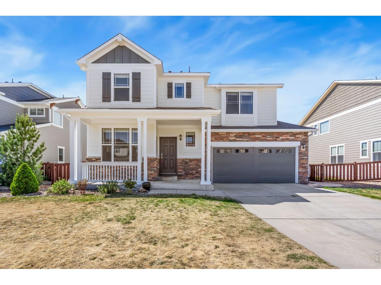 6759 Rainier Road Timnath, CO 80547 - Photo 29 of 30 a front view of a house with a yard