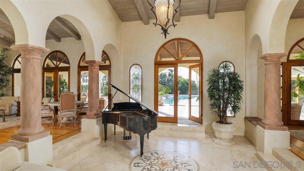 16556 Los Barbos Rancho Santa Fe, CA 92067 - Photo 11 of 22 a living room with furniture and a potted plant