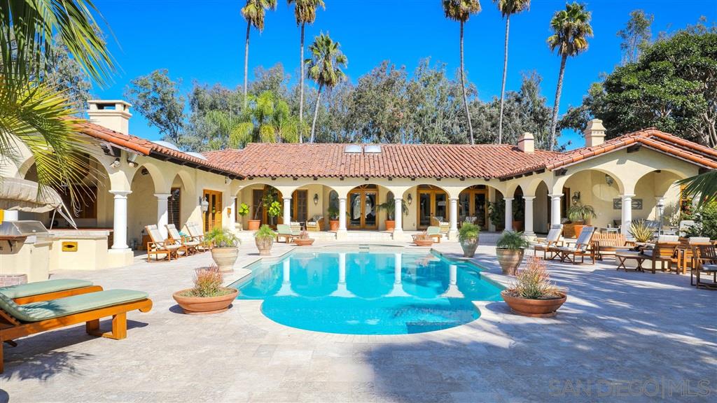 16556 Los Barbos Rancho Santa Fe, CA 92067 - Photo 16 of 22 a view of a house with swimming pool and sitting area