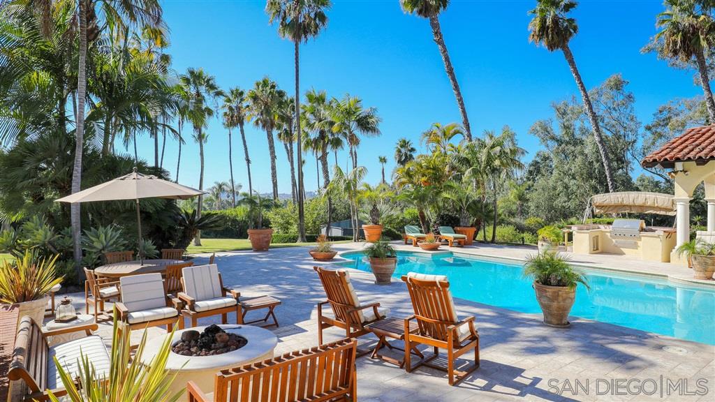 16556 Los Barbos Rancho Santa Fe, CA 92067 - Photo 20 of 22 a view of a swimming pool with lounge chairs