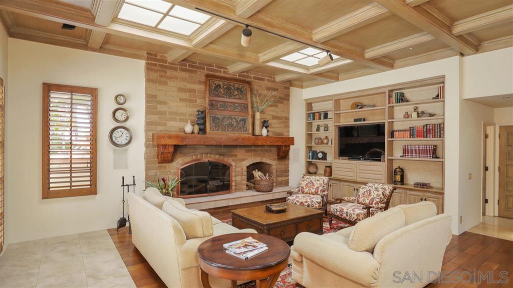 16556 Los Barbos Rancho Santa Fe, CA 92067 - Photo 7 of 22 a living room with furniture and a fireplace