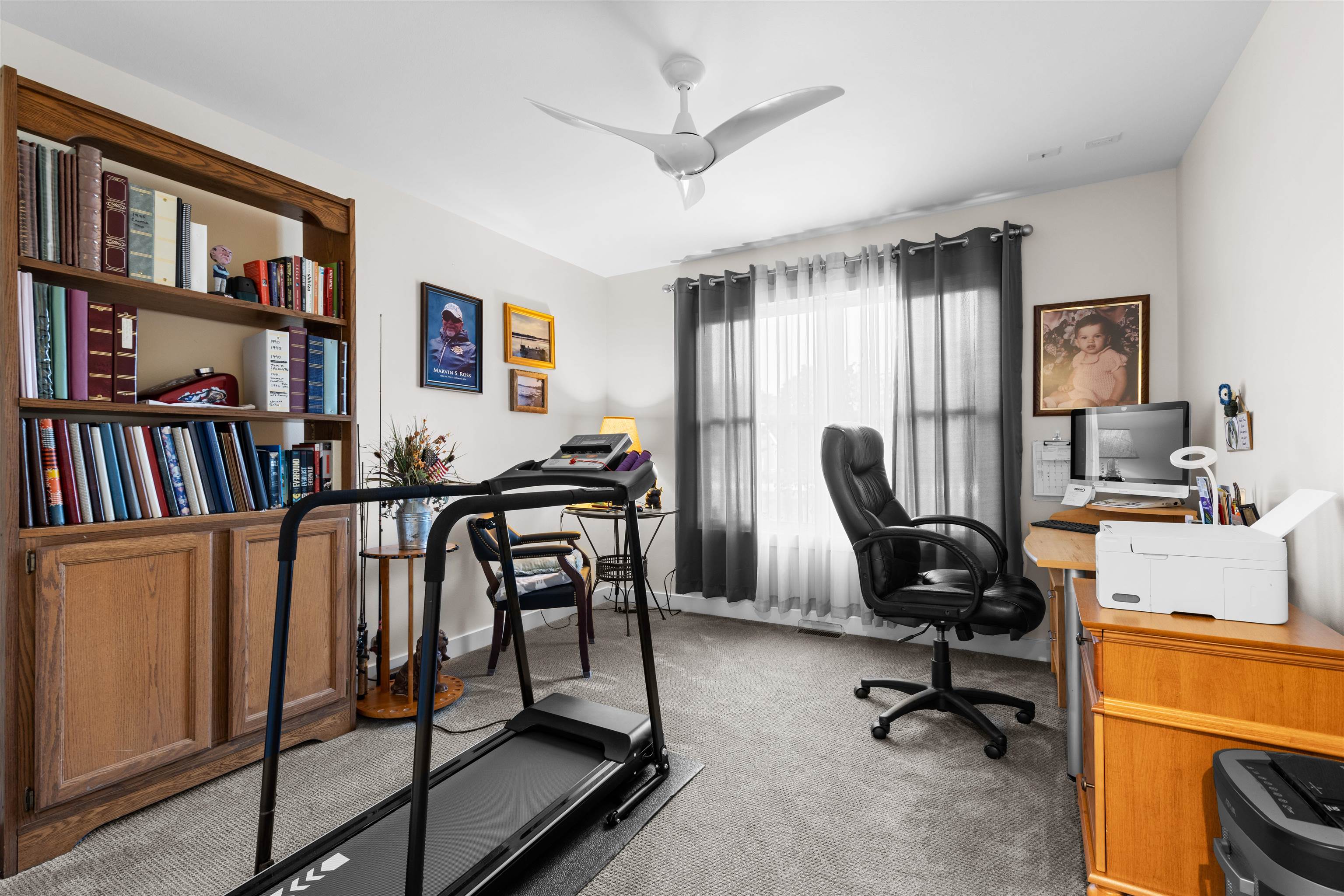 113 Taylor Lane Thomson, IL 61285 - Photo 15 of 29 a view of a workspace with furniture and a bookshelf