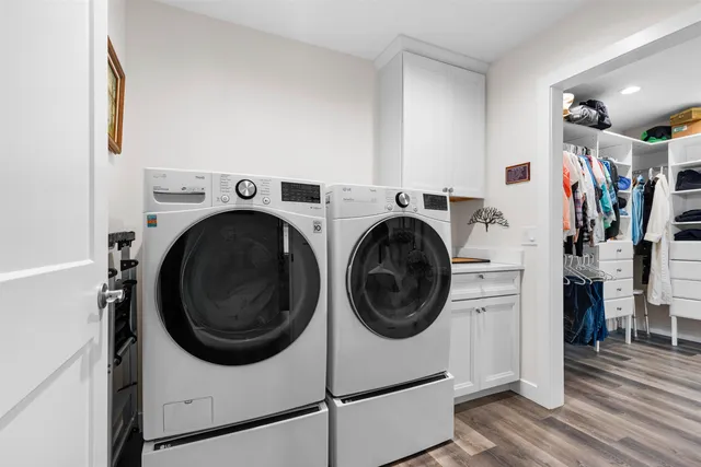 a view of a hallway with washer and dryer