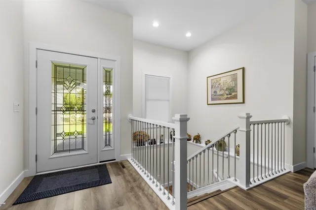 a view of entryway with wooden floor