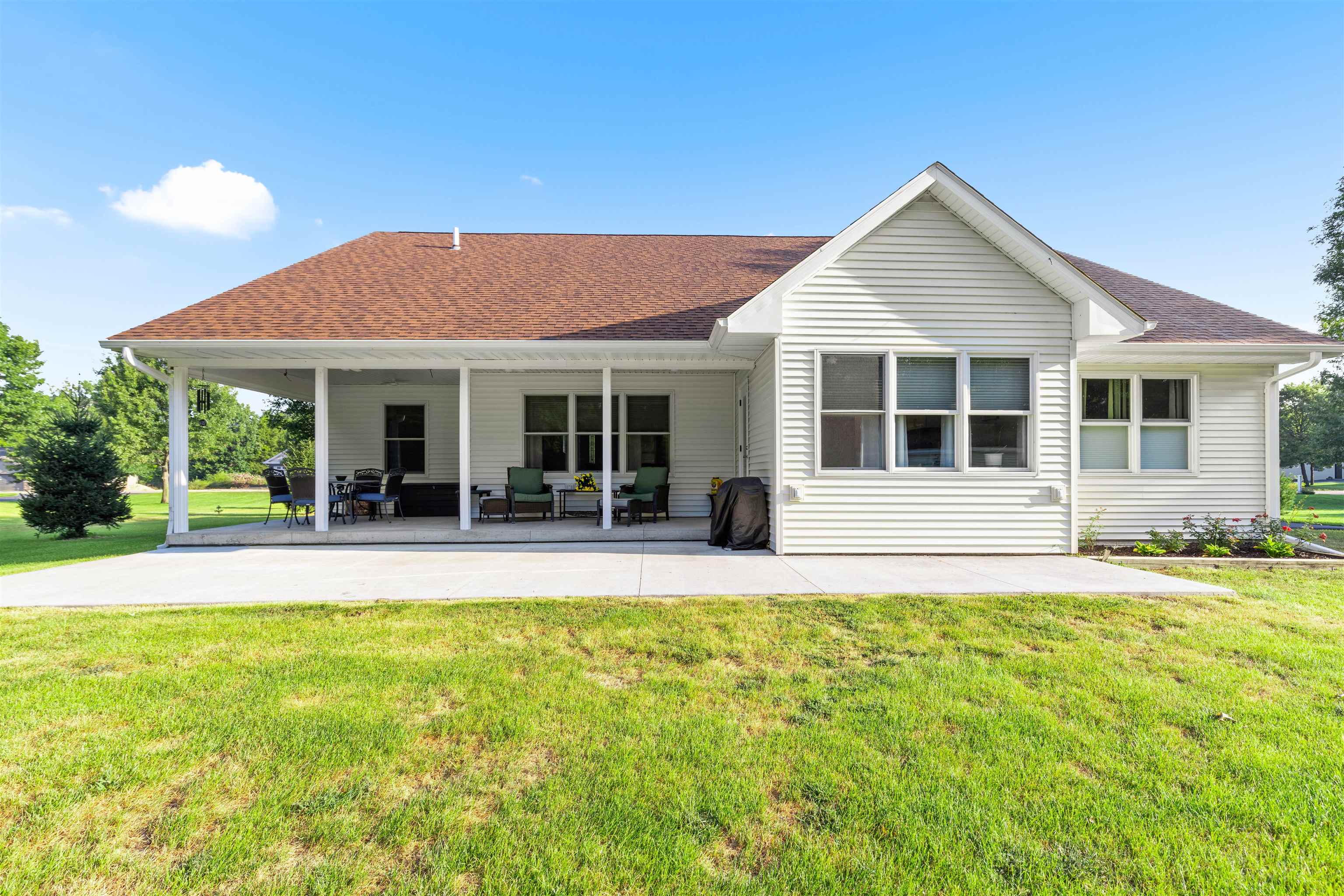 113 Taylor Lane Thomson, IL 61285 - Photo 24 of 29 a view of a house with a yard and potted plants