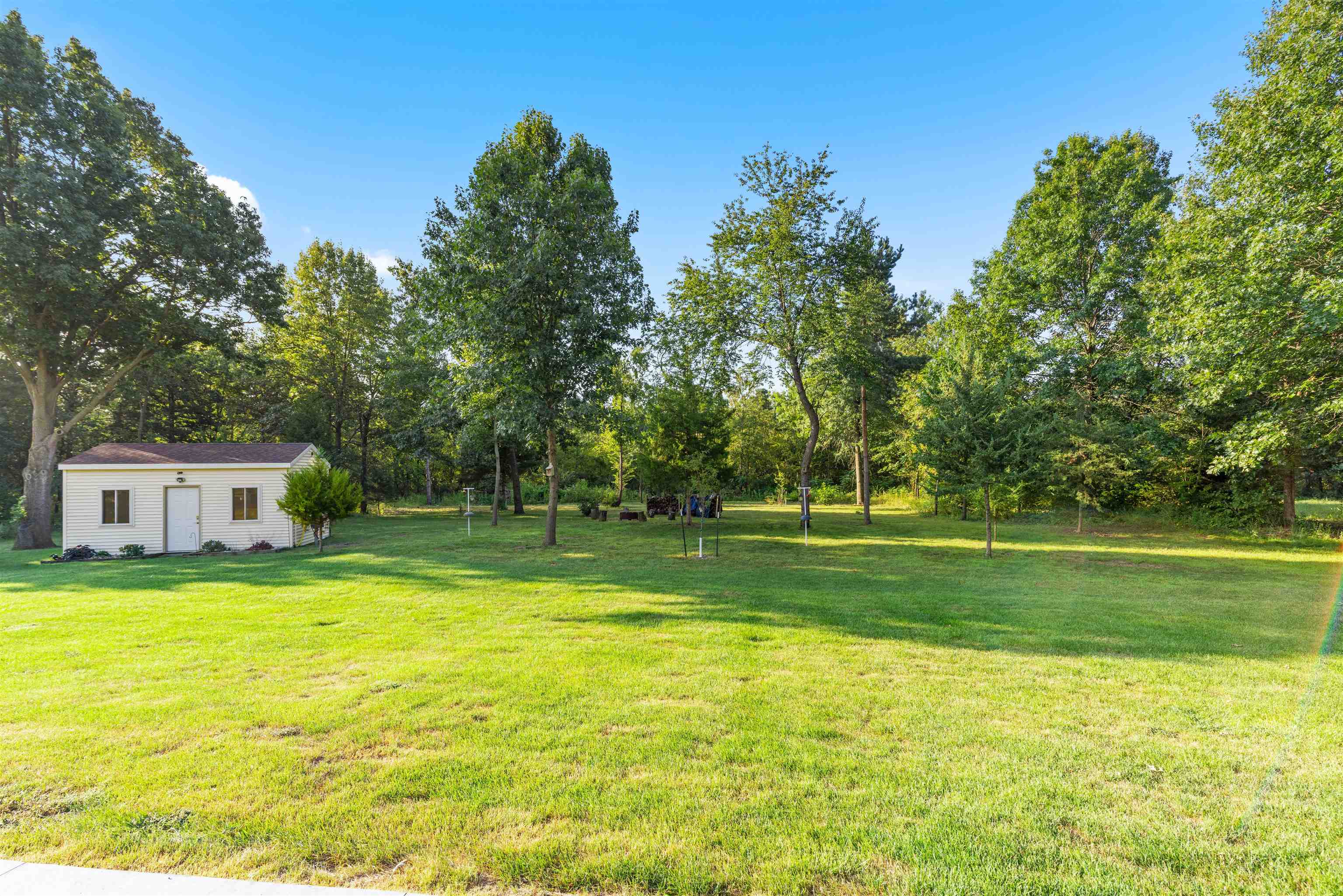 113 Taylor Lane Thomson, IL 61285 - Photo 27 of 29 a view of swimming pool with a garden and trees