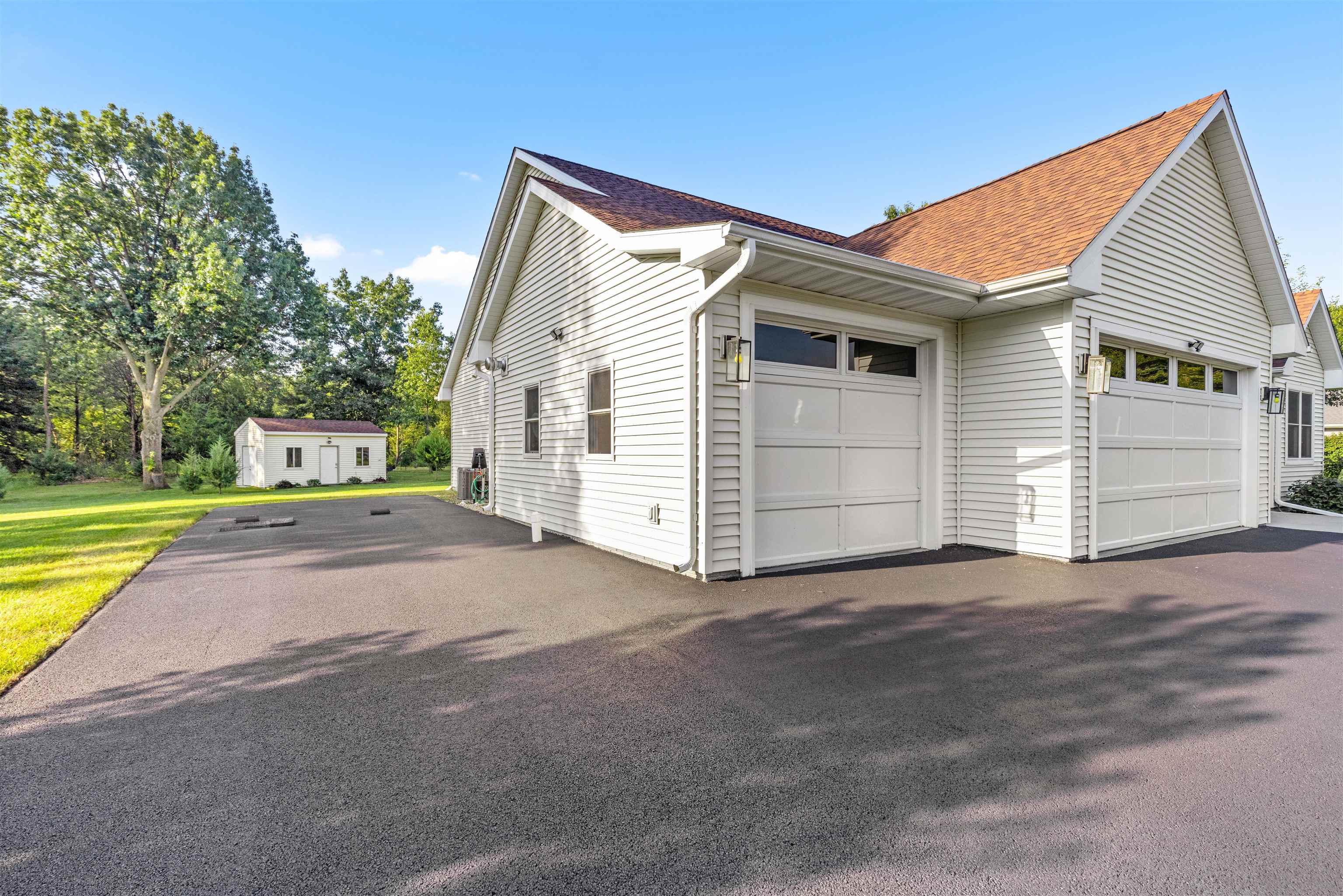 113 Taylor Lane Thomson, IL 61285 - Photo 29 of 29 a view of a house with a yard and garage