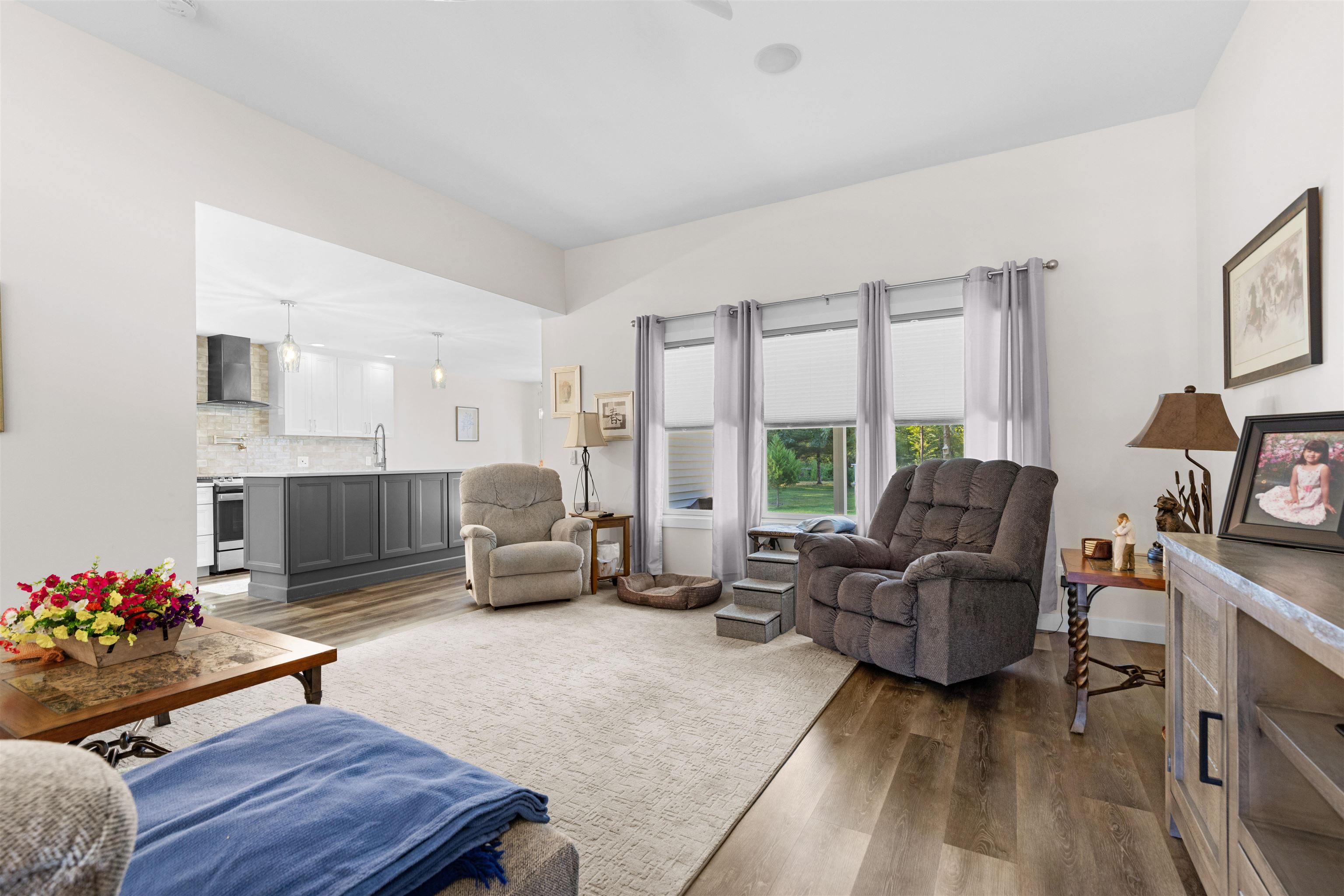 113 Taylor Lane Thomson, IL 61285 - Photo 4 of 29 a living room with furniture fireplace and a large window
