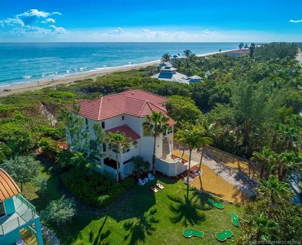 an aerial view of a house with a garden