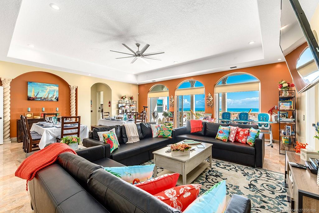 1981 Northeast Ocean Boulevard Stuart, FL 34996 - Photo 12 of 51 a living room with lots of furniture and a large window