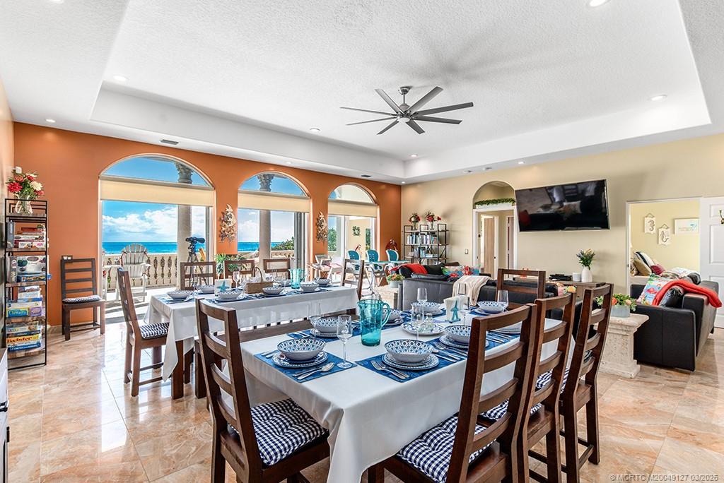 1981 Northeast Ocean Boulevard Stuart, FL 34996 - Photo 15 of 51 a view of a dining room with furniture window and outside view