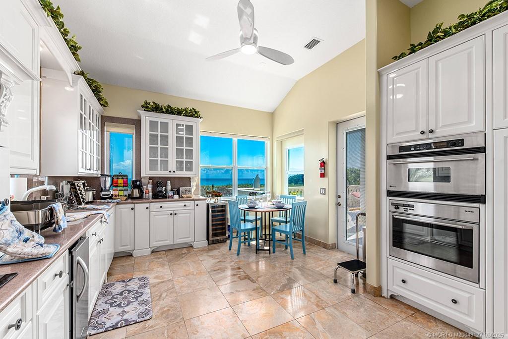 1981 Northeast Ocean Boulevard Stuart, FL 34996 - Photo 17 of 51 a kitchen with a stove a sink and a refrigerator