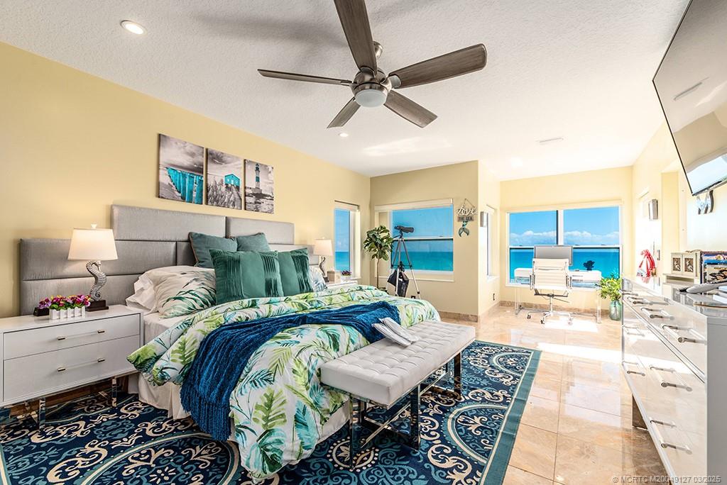 1981 Northeast Ocean Boulevard Stuart, FL 34996 - Photo 19 of 51 a living room with furniture and a chandelier