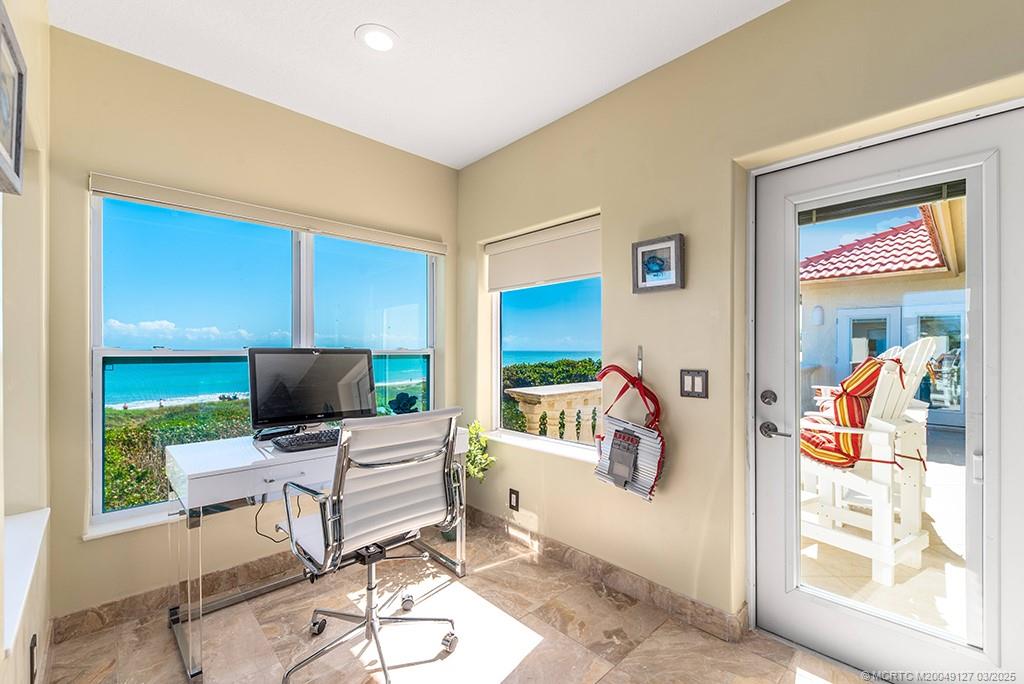1981 Northeast Ocean Boulevard Stuart, FL 34996 - Photo 20 of 51 a living room with furniture and a flat screen tv