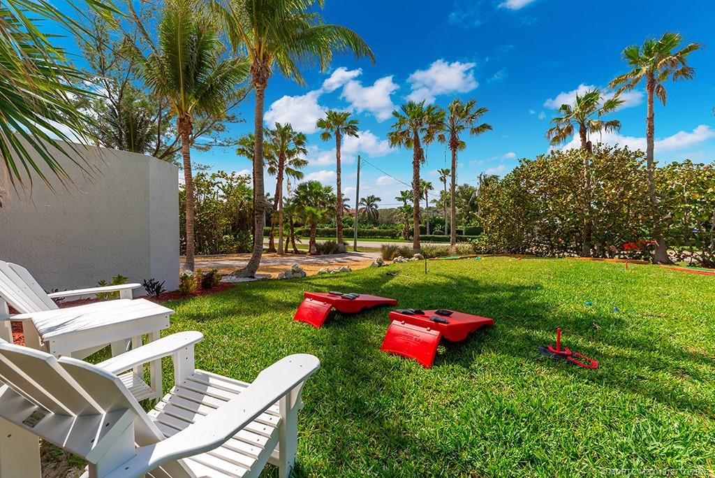 1981 Northeast Ocean Boulevard Stuart, FL 34996 - Photo 28 of 51 a view of a chair and table on the garden