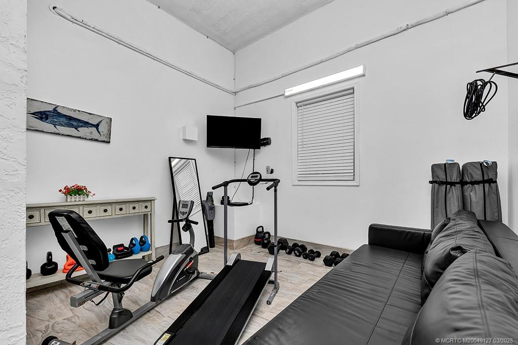 1981 Northeast Ocean Boulevard Stuart, FL 34996 - Photo 45 of 51 a view of a workspace with furniture and a window