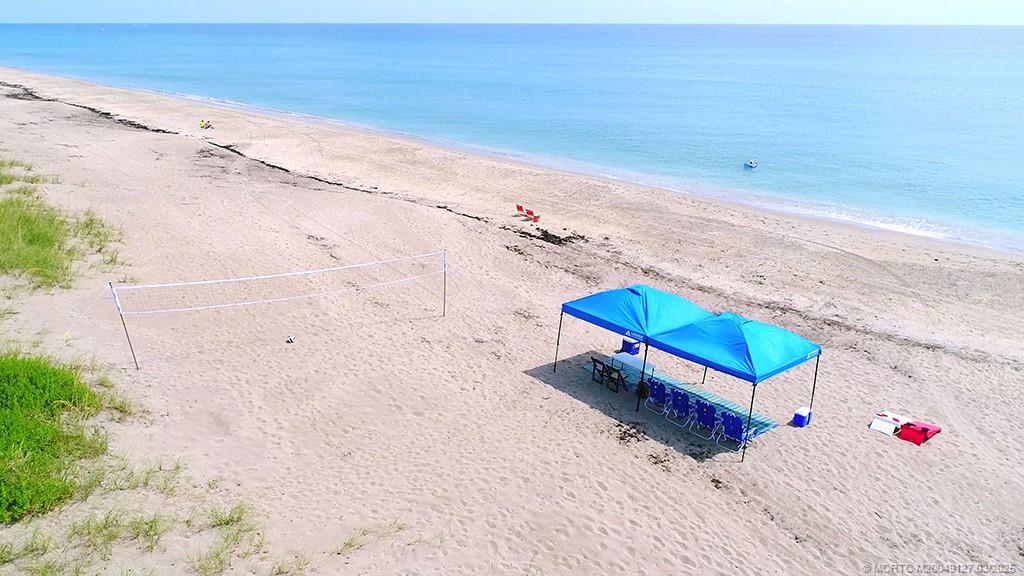 1981 Northeast Ocean Boulevard Stuart, FL 34996 - Photo 9 of 51 a backyard of a house with wooden floor