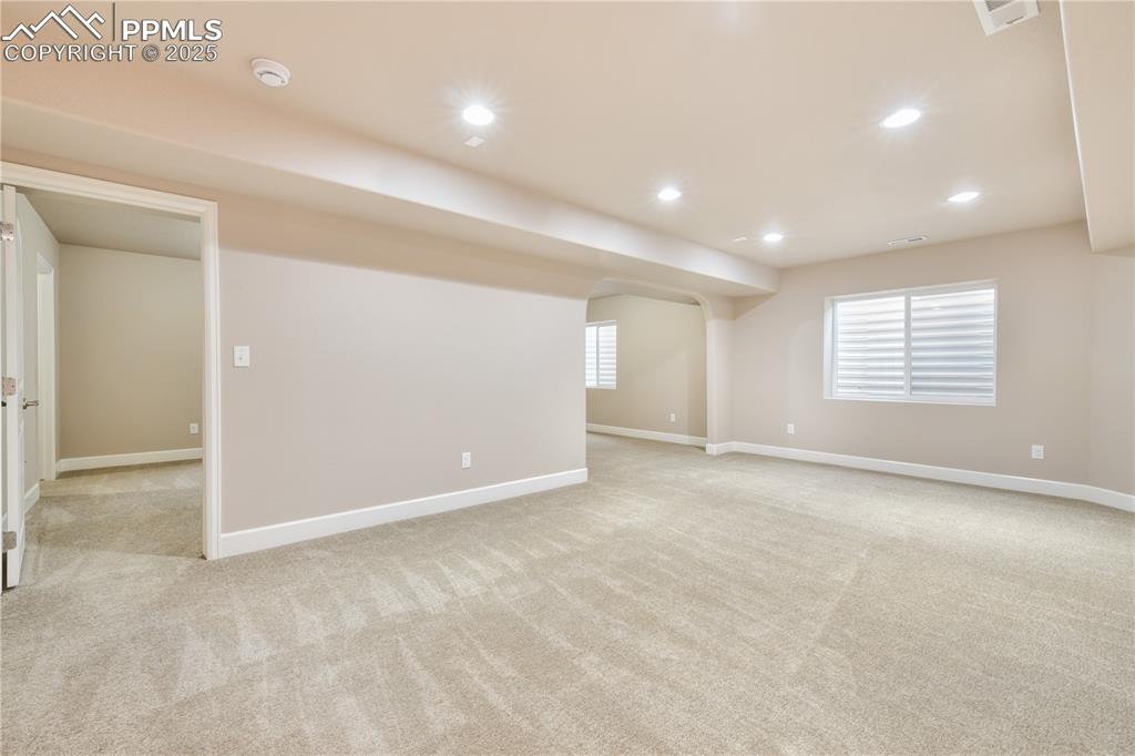 10484 Mile Post Loop Fountain, CO 80817 - Photo 34 of 50 an empty room with windows and pillars in it