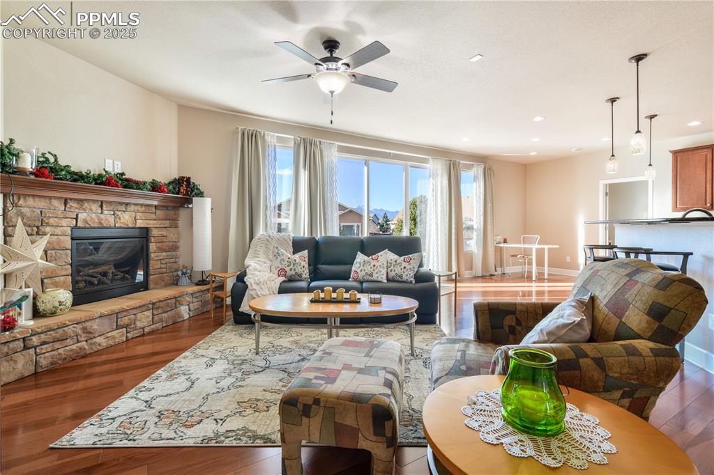 10484 Mile Post Loop Fountain, CO 80817 - Photo 7 of 50 a living room with furniture and a fireplace