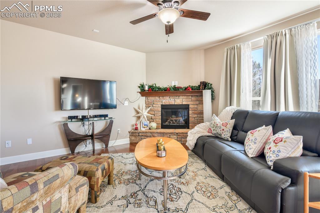 10484 Mile Post Loop Fountain, CO 80817 - Photo 8 of 50 a living room with furniture and a fireplace