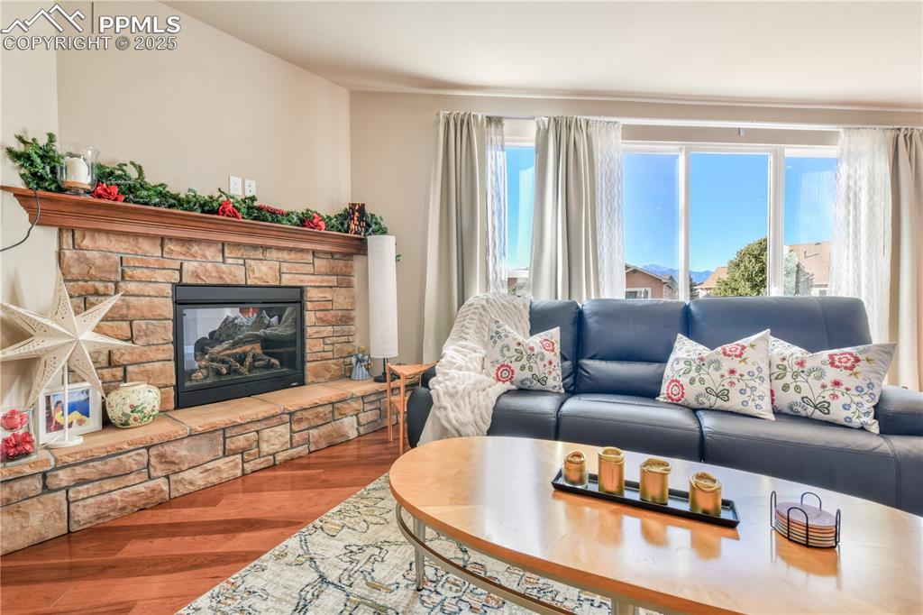 10484 Mile Post Loop Fountain, CO 80817 - Photo 9 of 50 a living room with furniture and a fireplace