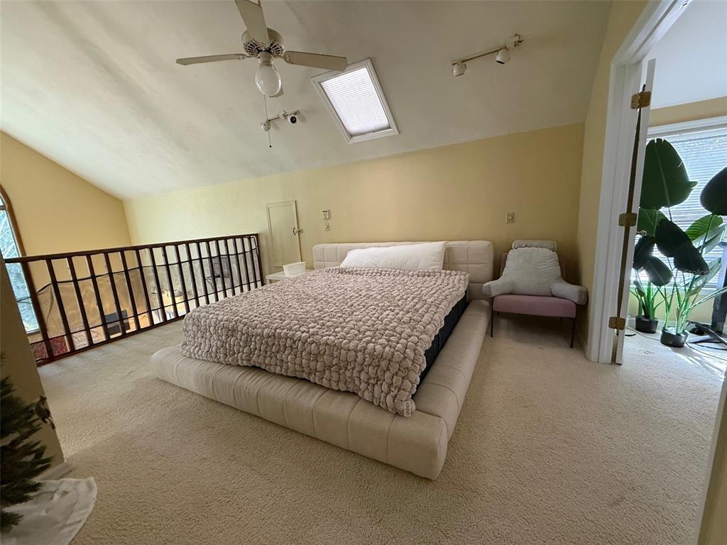 5601 Southwest 83 Drive Gainesville, FL 32608 - Photo 12 of 21 a bed room with a bed and a couch