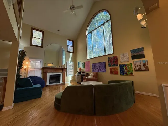 a living room with furniture fireplace and a fireplace