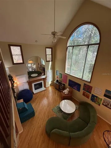 a living room with furniture and a fireplace