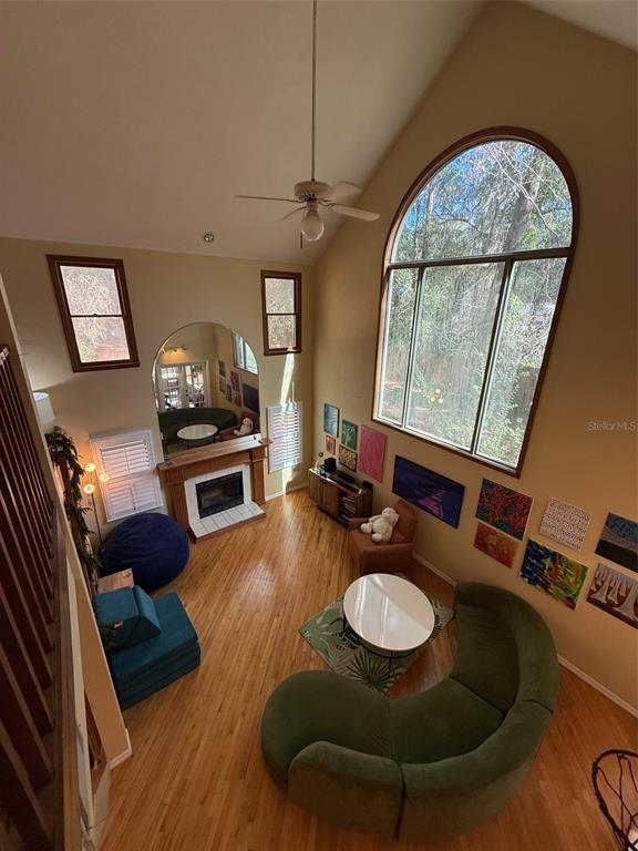 5601 Southwest 83 Drive Gainesville, FL 32608 - Photo 5 of 21 a living room with furniture and a fireplace