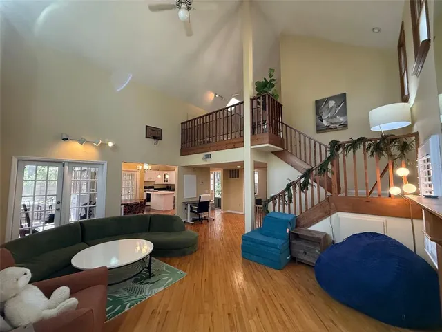 a living room with furniture and a dining table