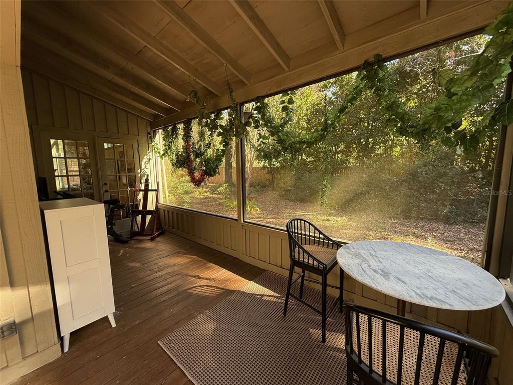 5601 Southwest 83 Drive Gainesville, FL 32608 - Photo 10 of 21 a view of a chairs and table in the patio