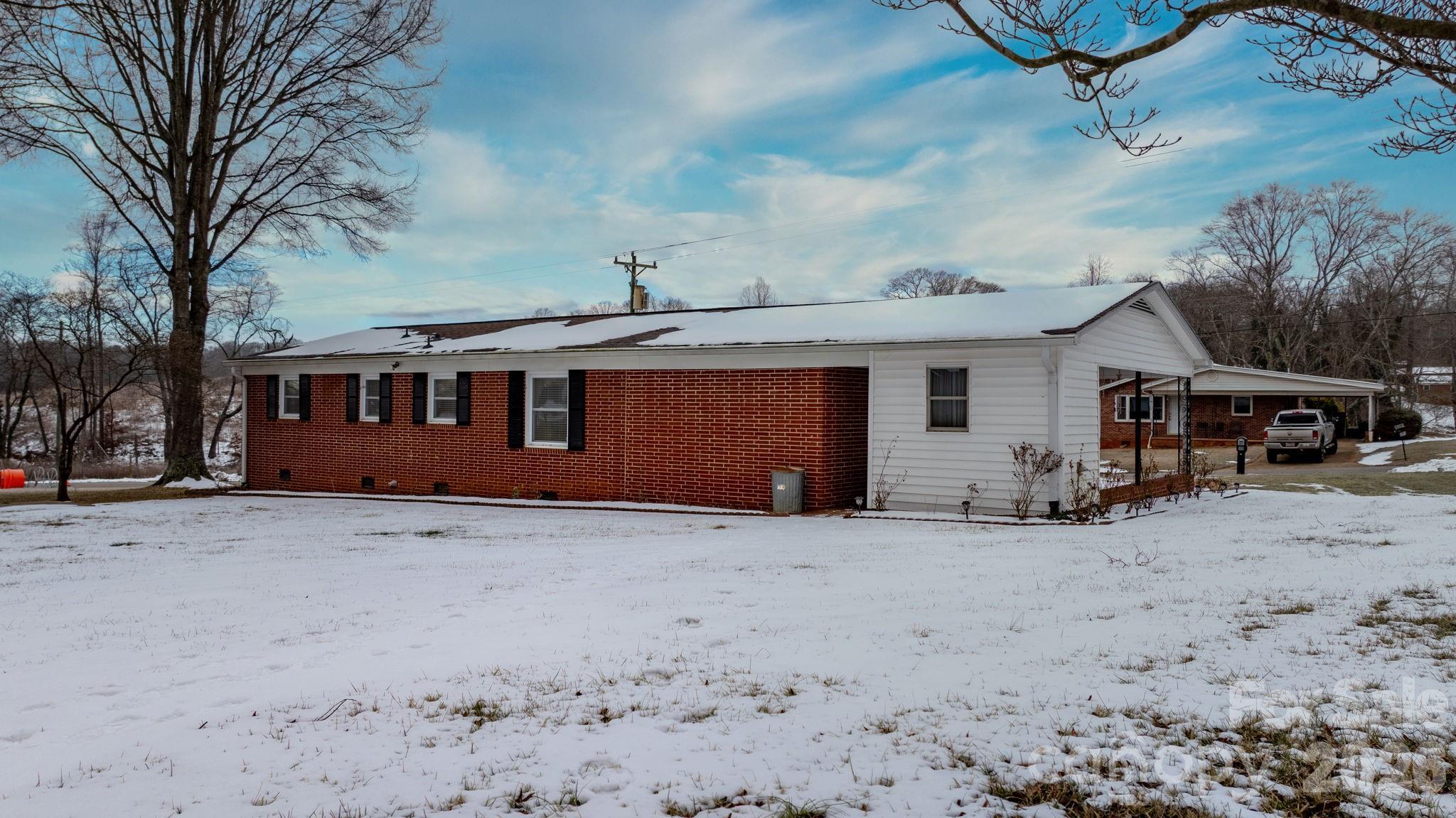 1802 33rd Street Northeast Hickory, NC 28601 - Photo 12 of 21 a view of a house with a snow in the yard