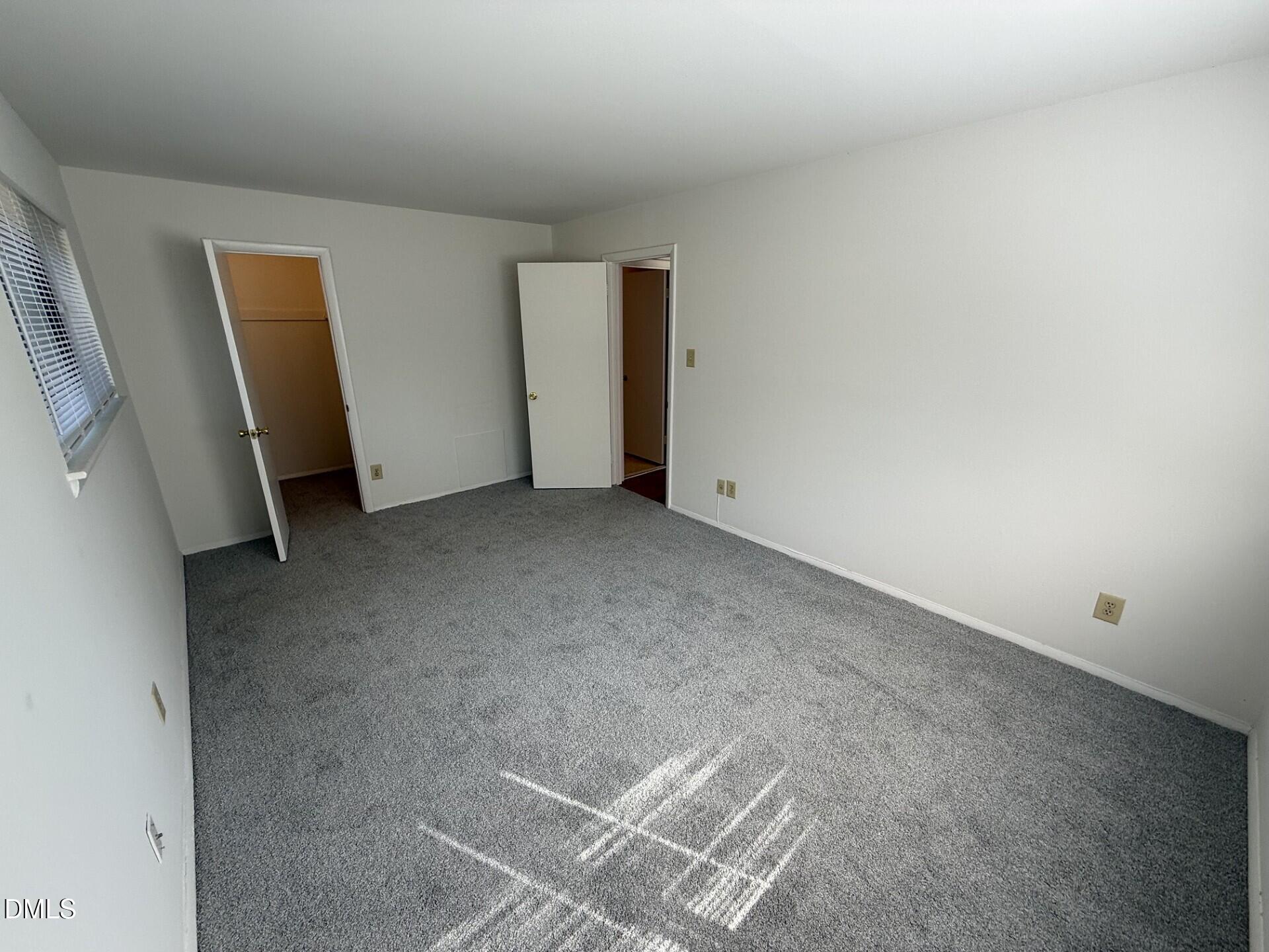 1299 Schaub Drive, Unit D Raleigh, NC 27606 - Photo 9 of 16 a view of an empty room