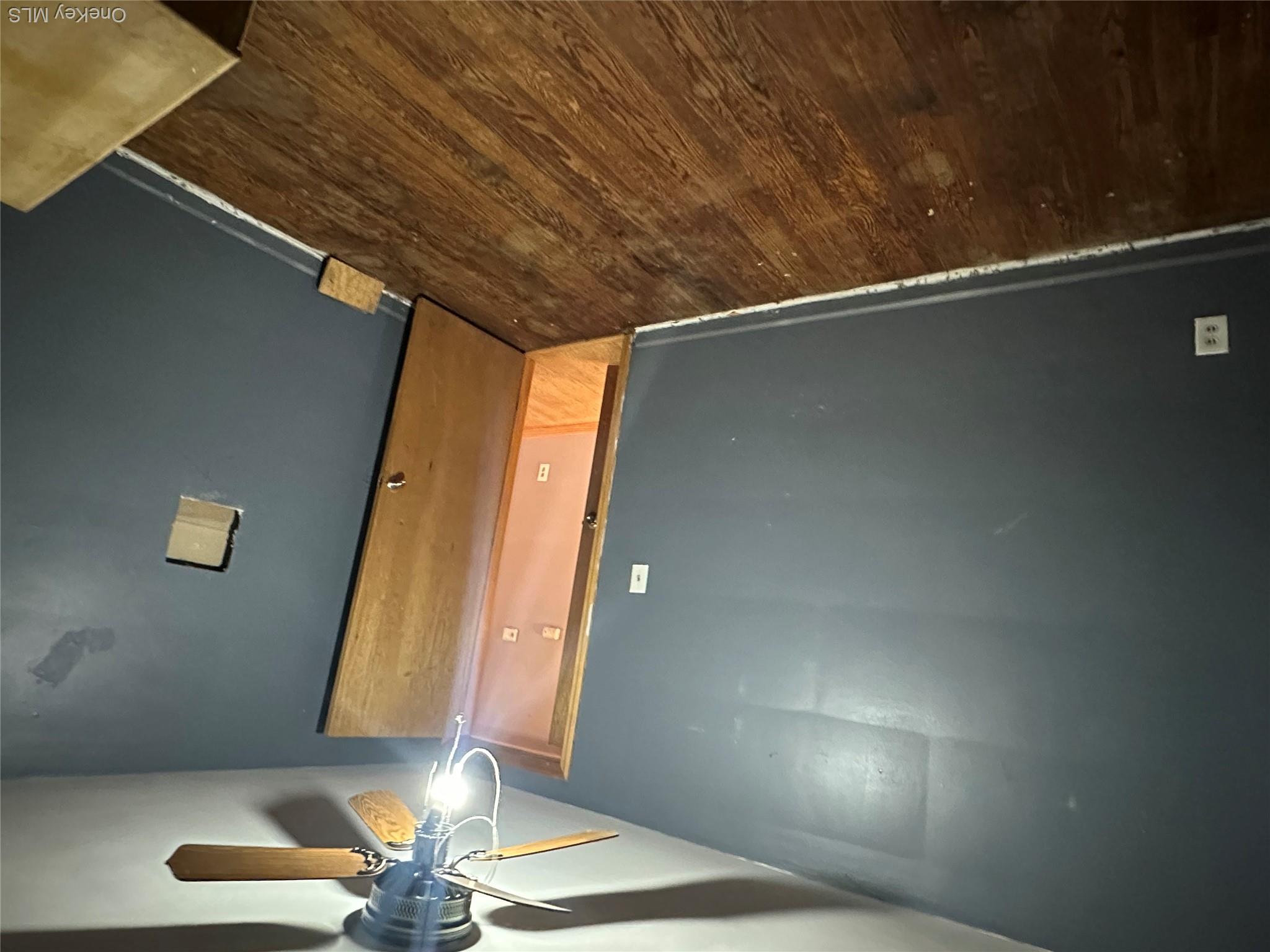 12 Bruce Street Newburgh, NY 12550 - Photo 8 of 8 en empty room with wooden floor and fan
