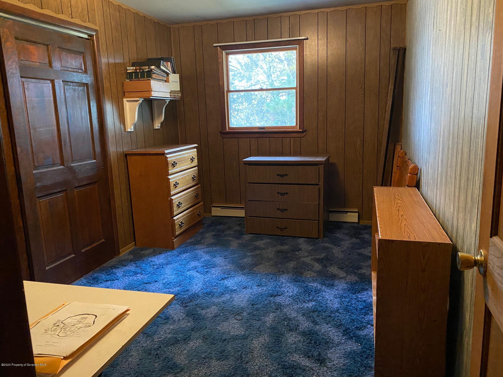 25 Dennis Road Scott Township, PA 18447 - Photo 17 of 43 a room with a bed and a dresser