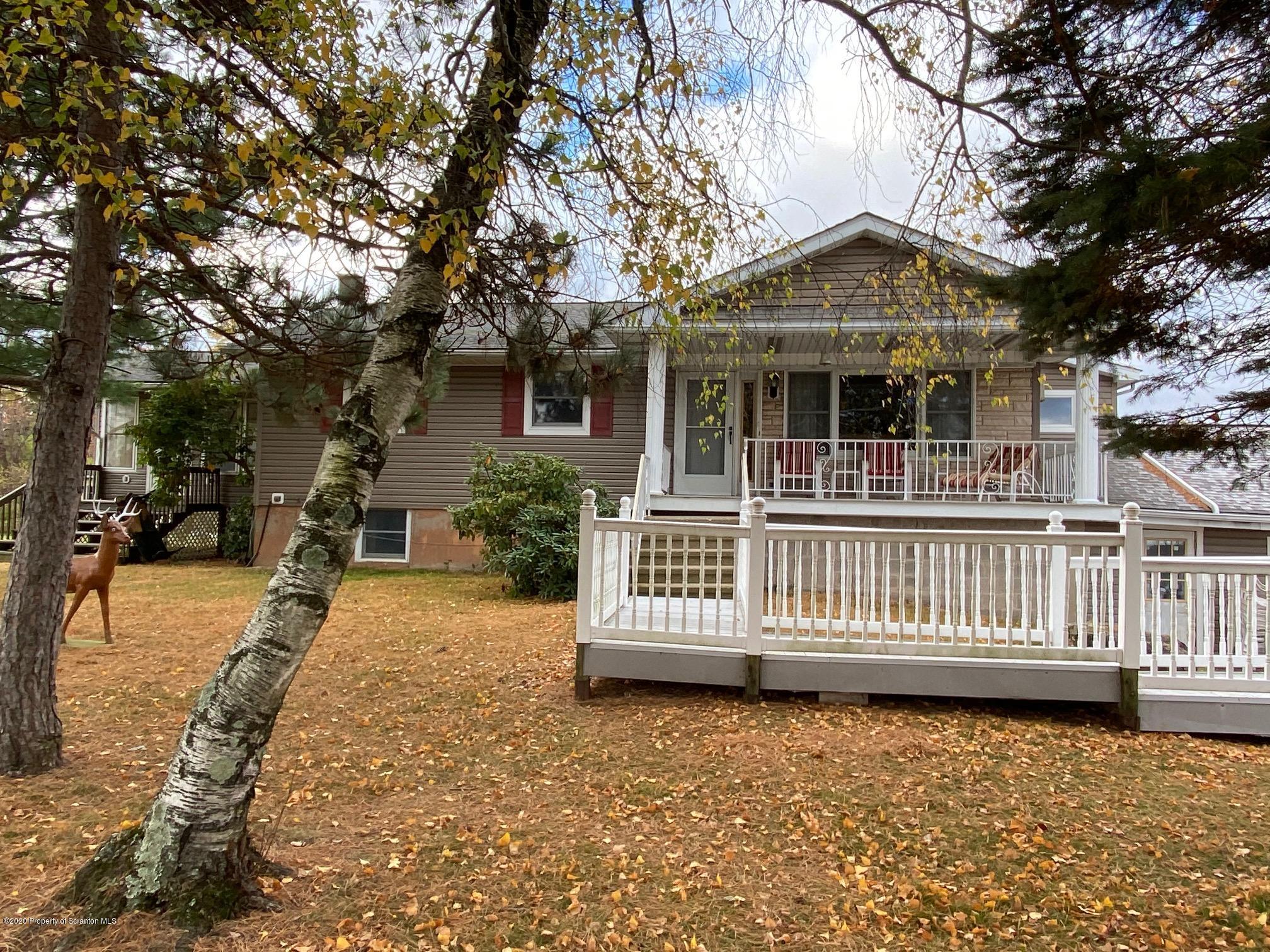25 Dennis Road Scott Township, PA 18447 - Photo 2 of 43 a front view of a house with a garden