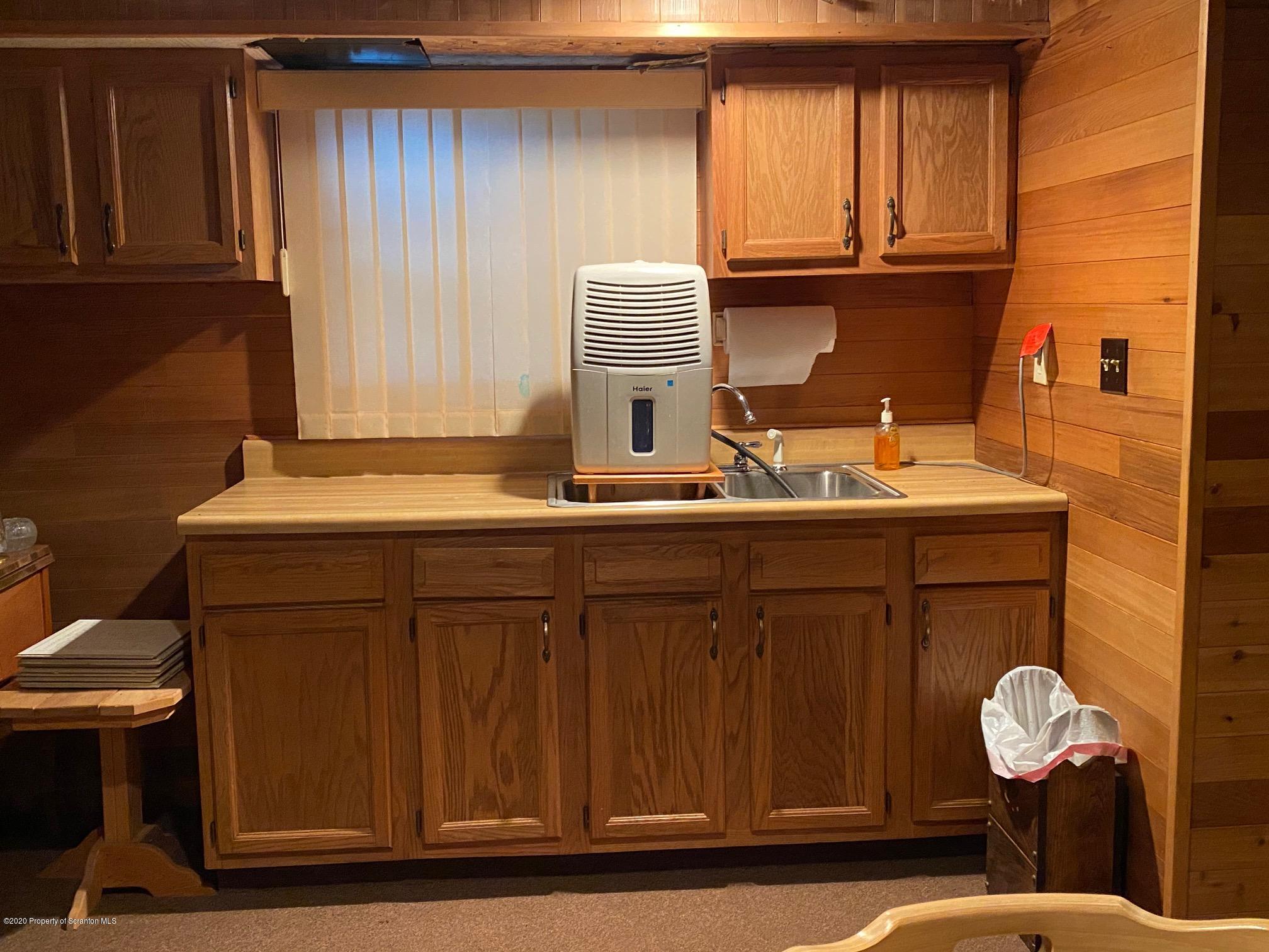 25 Dennis Road Scott Township, PA 18447 - Photo 25 of 43 a bathroom with a sink and a mirror