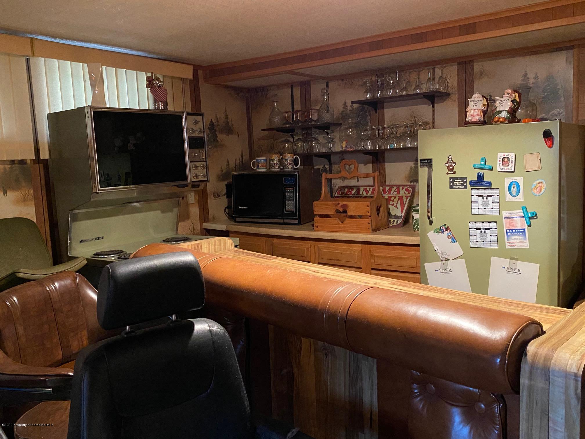 25 Dennis Road Scott Township, PA 18447 - Photo 26 of 43 a living room with furniture and a flat screen tv