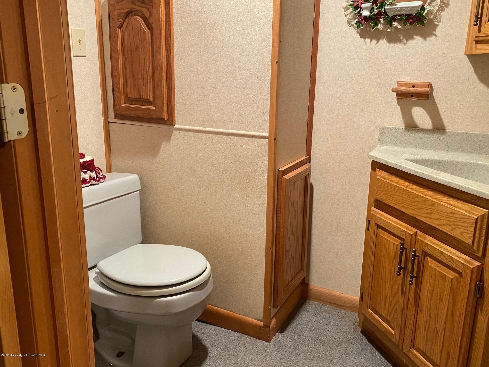 25 Dennis Road Scott Township, PA 18447 - Photo 30 of 43 a bathroom with a toilet and a shower