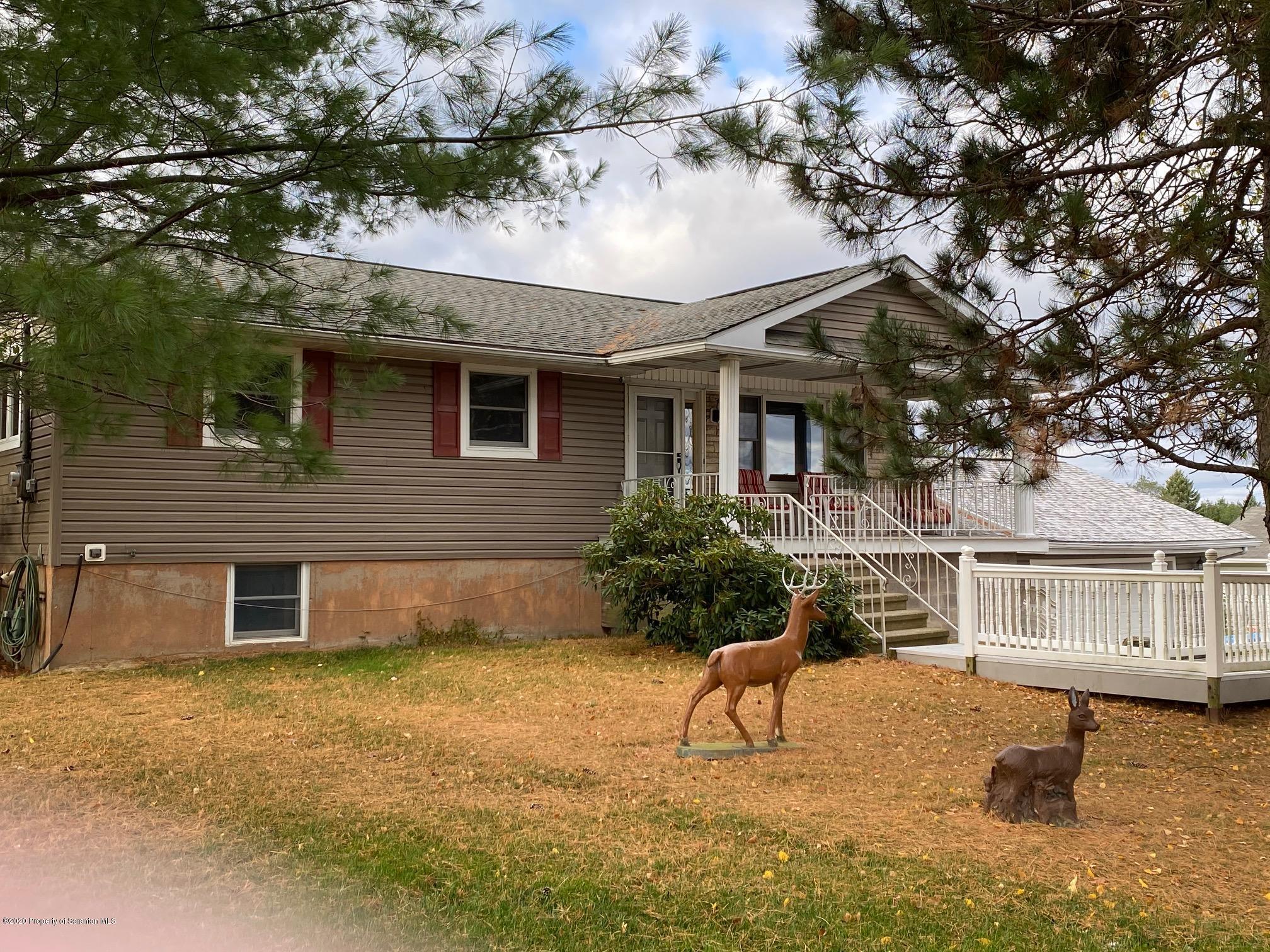 25 Dennis Road Scott Township, PA 18447 - Photo 3 of 43 a brick house with large trees and outdoor space