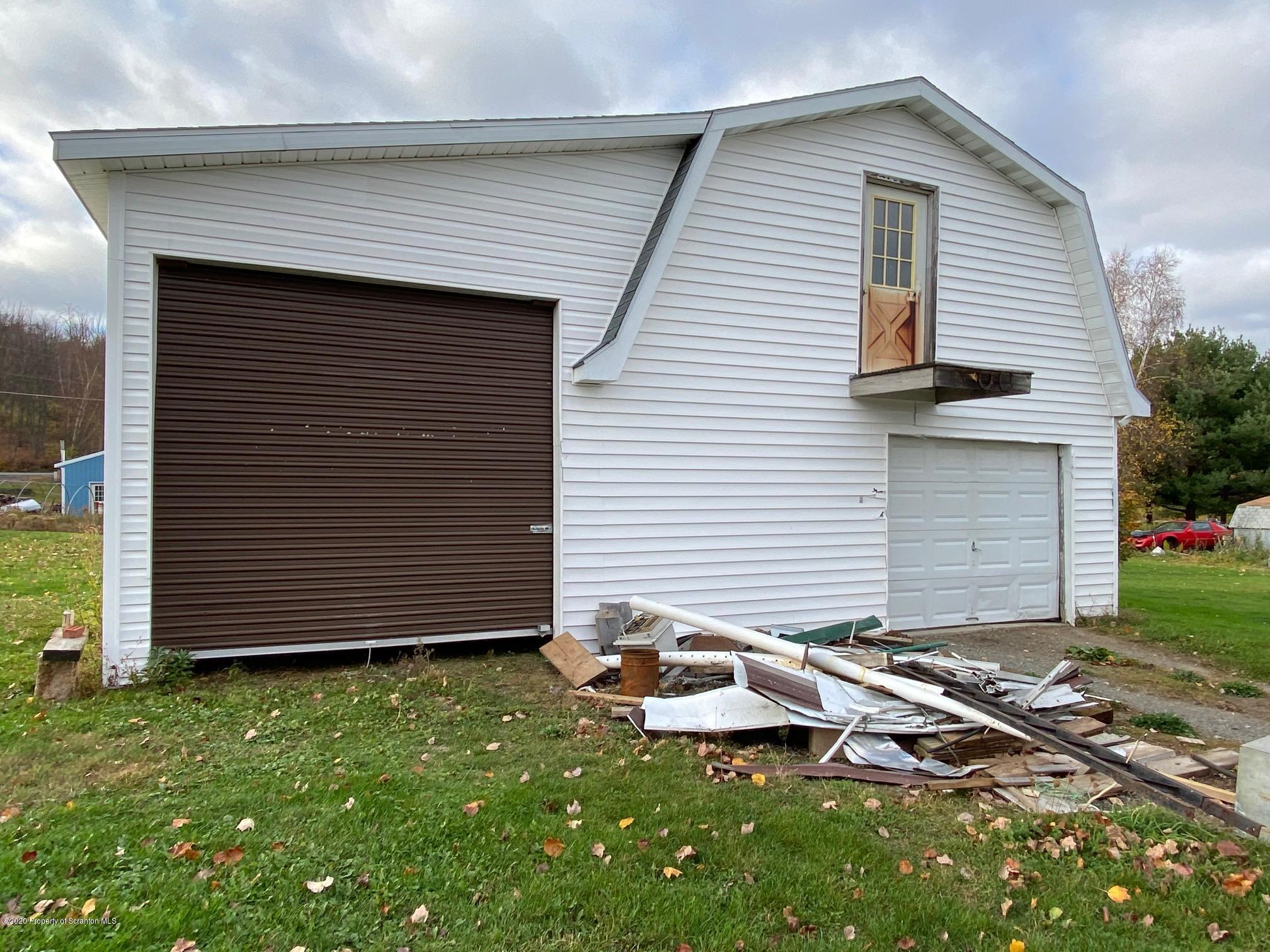 25 Dennis Road Scott Township, PA 18447 - Photo 37 of 43 a front view of a house with a garden