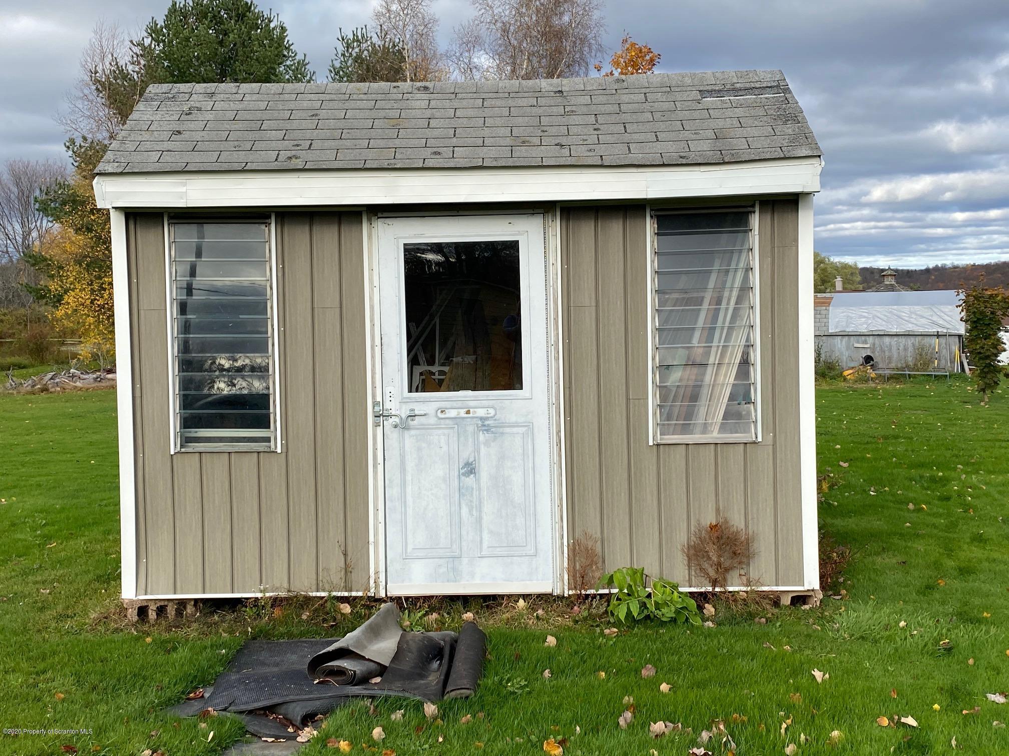 25 Dennis Road Scott Township, PA 18447 - Photo 42 of 43 a front view of a house with garden